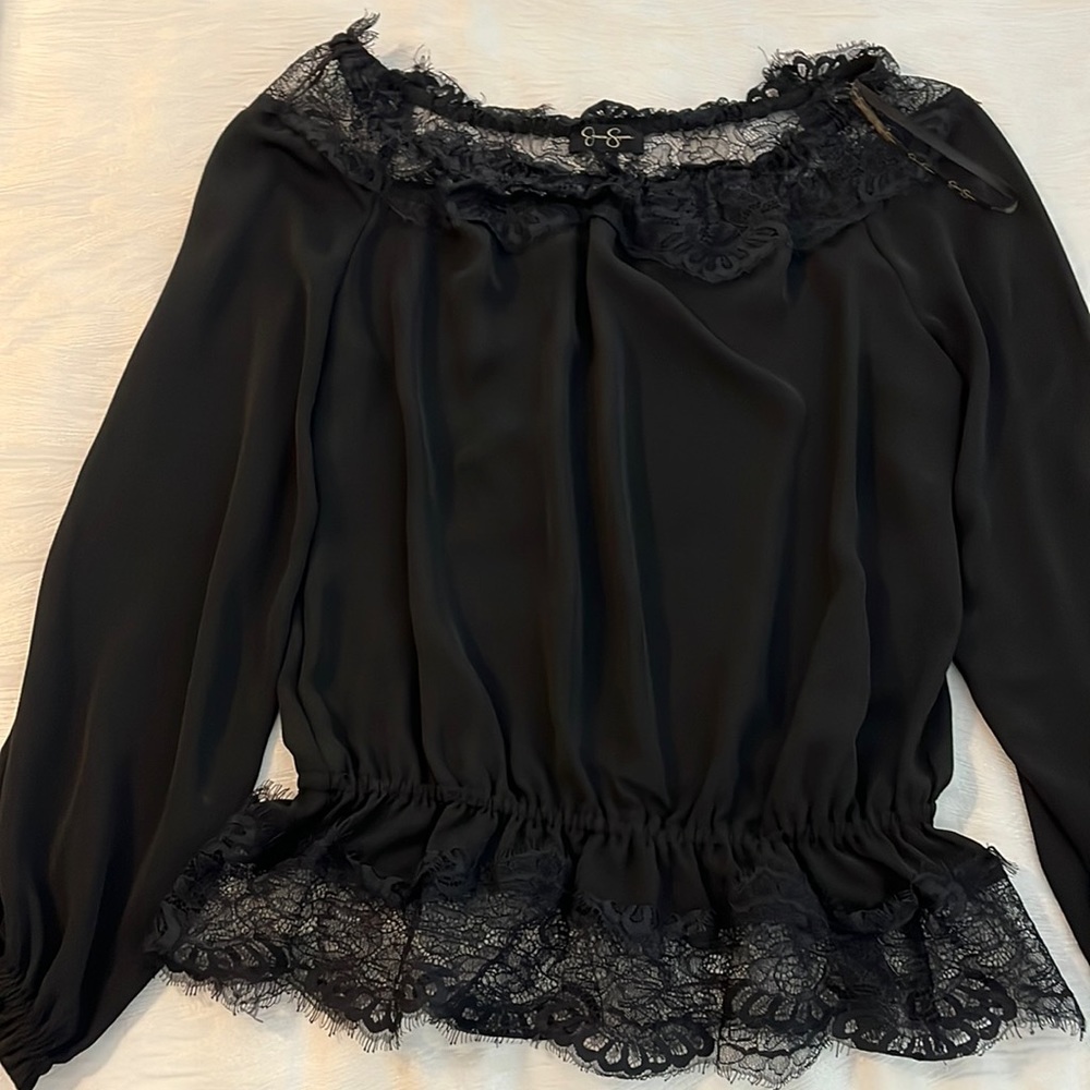 Black top with lace trim.